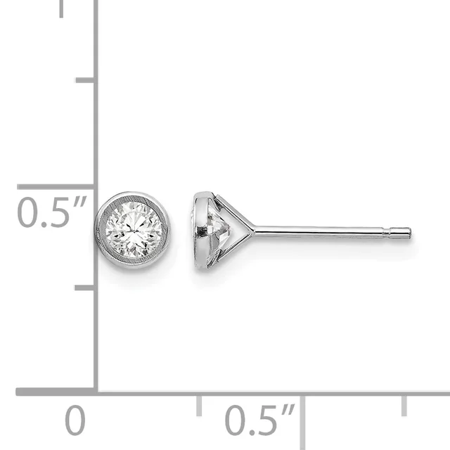 A pair of round diamond stud earrings with bezel settings shown next to a ruler indicating they are approximately 0.5 inches in diameter.