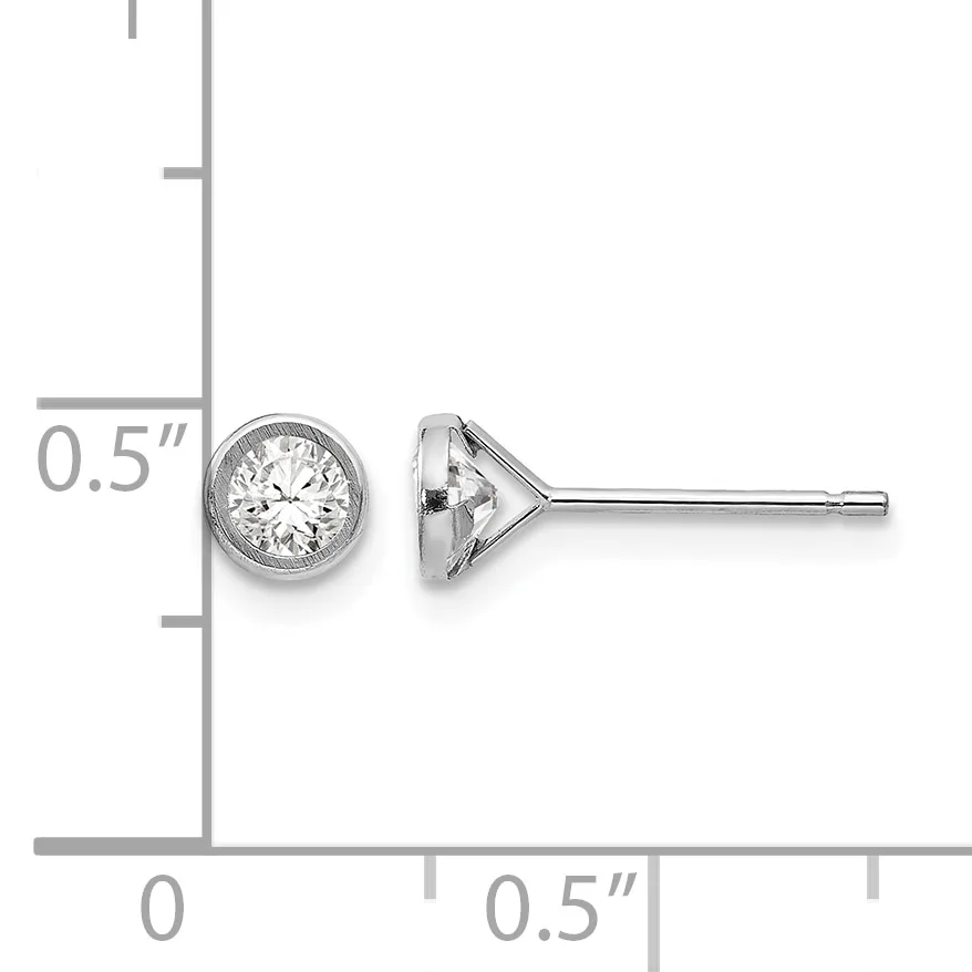 A pair of round diamond stud earrings with bezel settings shown next to a ruler indicating they are approximately 0.5 inches in diameter.