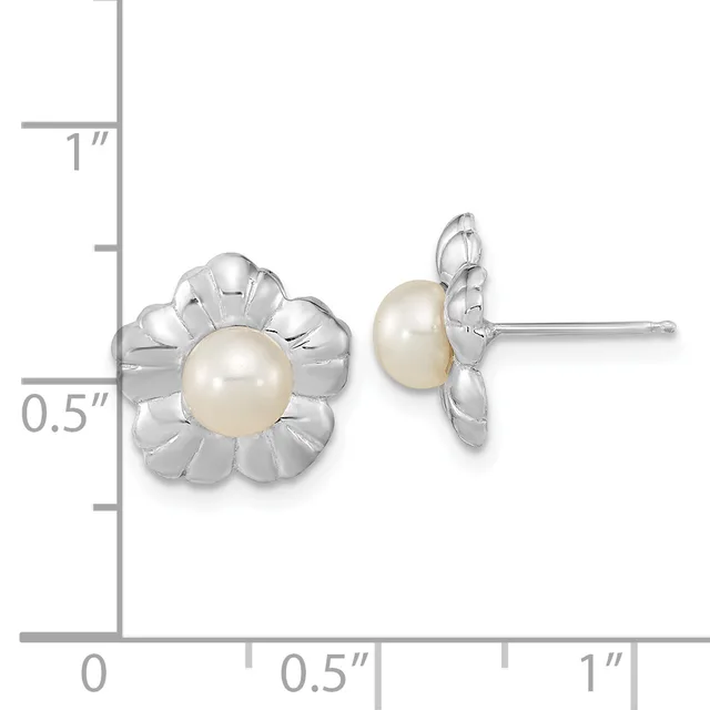 Silver flower-shaped stud earrings with cream pearls at the centers, displayed against a measurement scale showing approximately 0.75 inches in height.