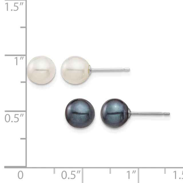 Two pairs of pearl stud earrings displayed against a measurement ruler: white pearls on top and black pearls below, each pair mounted on silver posts.