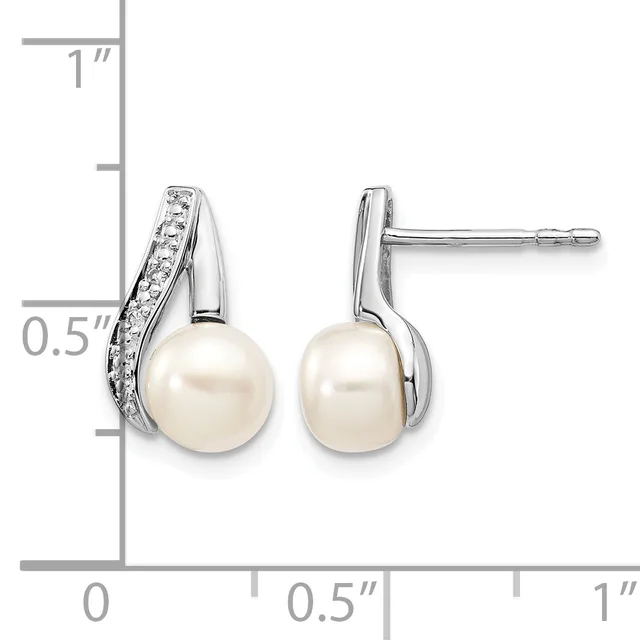 Pair of silver stud earrings featuring white pearls suspended below curved silver tops set with small diamonds, shown with a measurement scale.