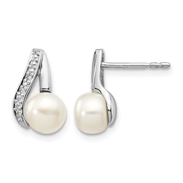Pair of silver stud earrings featuring white pearl drops suspended from curved silver tops set with small round diamonds.