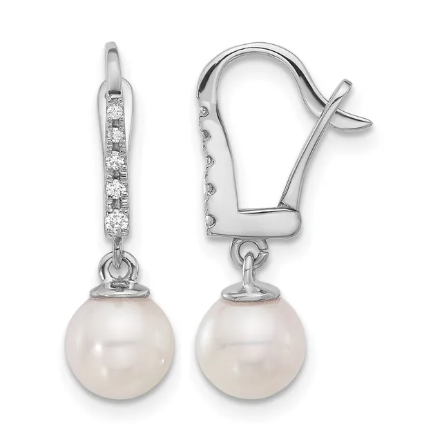 A pair of white metal drop earrings with diamond accents along the top and cream-colored pearl spheres suspended below, shown from front and side views.