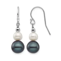 A pair of silver drop earrings with white pearl tops, dark gray pearl bottoms, and faceted metal spacer beads between them, displayed against a white background.