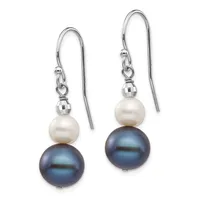 A pair of silver earrings featuring dark blue pearls topped with white pearls and small faceted silver beads, suspended from curved ear wires.