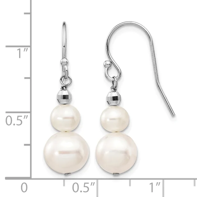 A pair of silver fishhook earrings with two stacked white pearls of graduated sizes on each earring, displayed against a measurement scale.