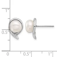 A pair of silver stud earrings with white pearl cabochons set in curved bezels, shown front and back view with measurement scale.