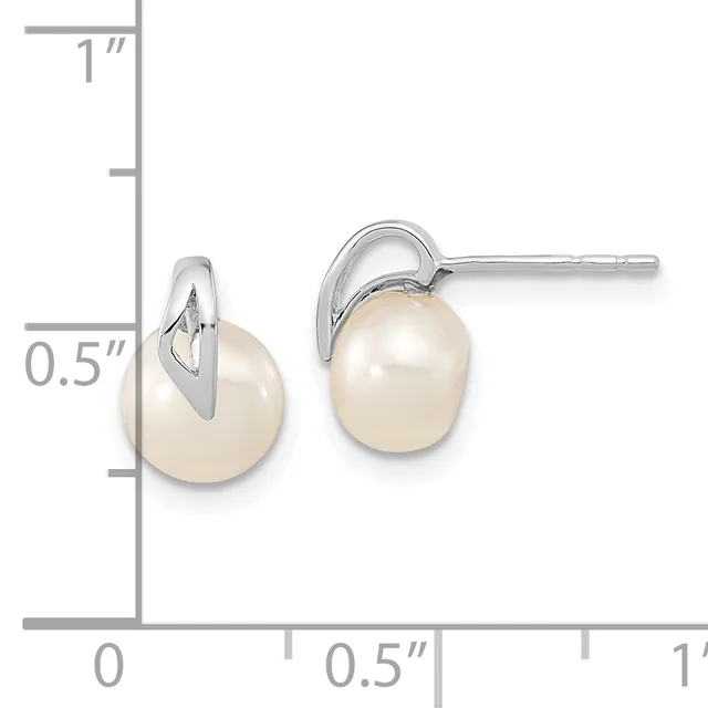 A pair of silver stud earrings with white pearl drops, shown next to a ruler indicating approximately 0.5 inches in height.