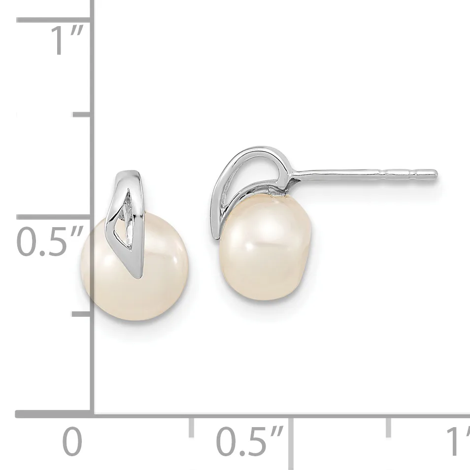 A pair of silver stud earrings with white pearl drops, shown next to a ruler indicating approximately 0.5 inches in height.