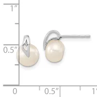 A pair of silver stud earrings with white pearl drops, shown next to a ruler indicating approximately 0.5 inches in height.