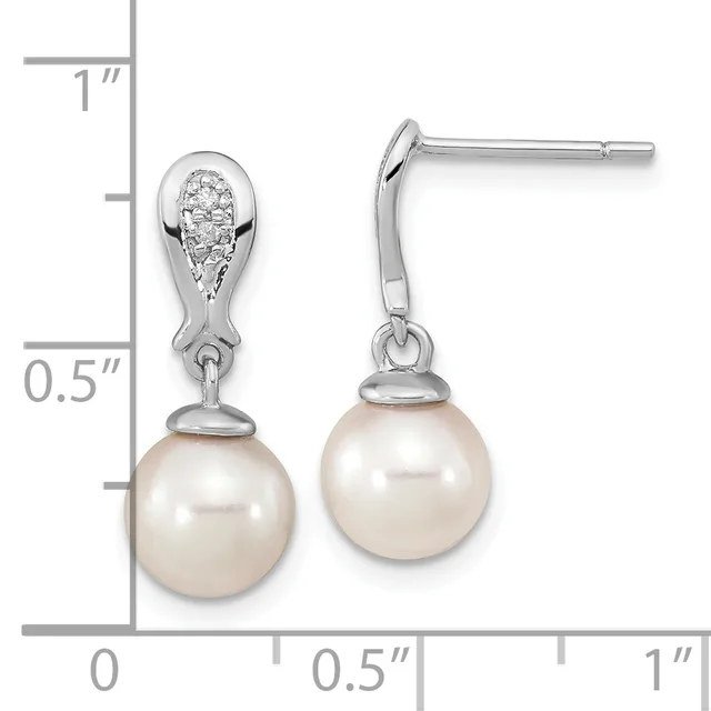 Pair of silver teardrop earrings with diamond-set tops and cream pearl drops, shown with measurement scale indicating approximately one inch in length.
