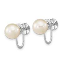 Pair of silver earrings with cream-colored pearl studs and curved wire hooks extending downward.