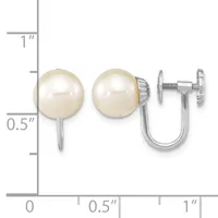 Pearl stud earrings with screw-back closures shown next to a ruler for scale, measuring approximately half an inch in diameter.