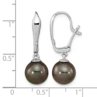 Pair of silver earrings with tapered polished caps above dark gray pearl drops, shown next to a ruler indicating approximately one inch in length.
