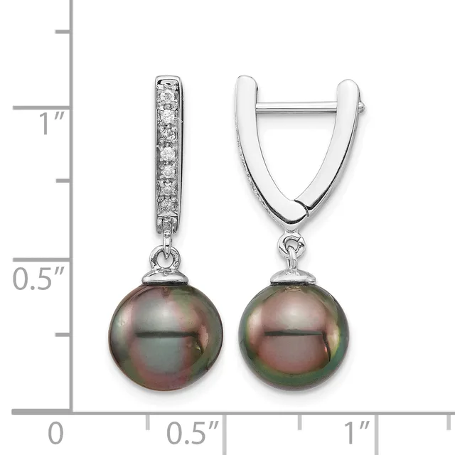 A pair of silver huggie earrings with diamond-set bails and dark tahitian pearl drops, shown next to a measurement scale indicating approximately one inch in length.