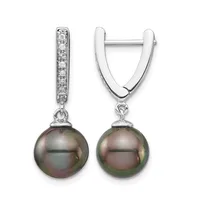 A pair of silver hoop earrings with diamond-accented posts and dark green pearl drops suspended below.