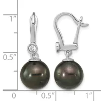A pair of silver lever-back earrings featuring dark gray pearl drops suspended below small round diamond studs, displayed against a measurement scale.