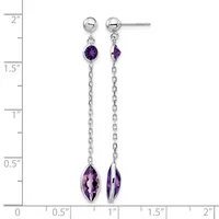 Silver dangle earrings with ball studs and chain, each featuring a small round purple stone at the top and a larger oval faceted purple stone at the bottom, displayed against a measurement ruler.