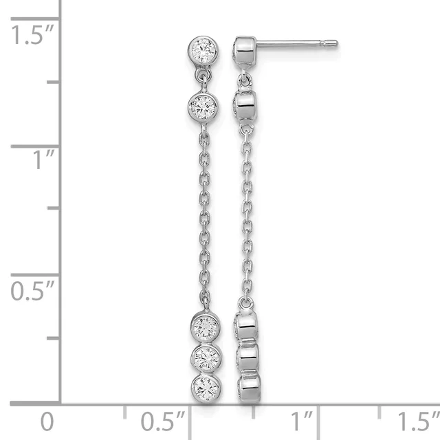 Pair of silver dangle earrings with cubic zirconia stones set in bezel settings along chain drops, shown against a measurement scale indicating approximately 1.5 inches in length.