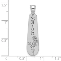 A polished silver teardrop pendant engraved with the name "Sarah" and a floral design, shown next to a ruler measuring approximately 1.25 inches in length.