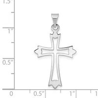 A silver cross pendant with ornate flared ends shown against a ruler measuring approximately 1.25 inches in height.