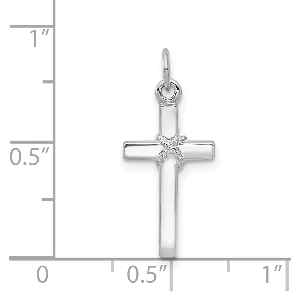 A silver cross pendant with a wrapped ribbon detail at the center, shown against a measurement scale indicating approximately 0.75 inches wide by 1.5 inches tall.