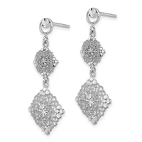 A pair of silver dangle earrings with oval stud tops connected by chains to two ornate diamond-shaped filigree pendants stacked vertically.