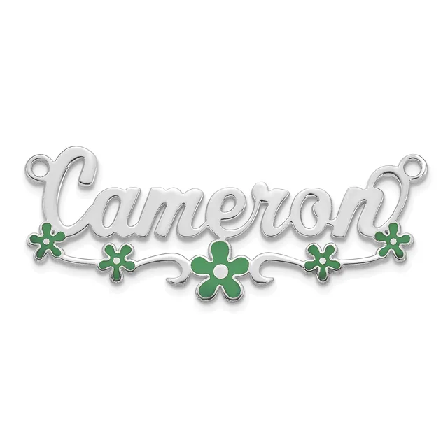 Silver pendant with the name Cameron in script lettering, decorated with green enamel four-petaled flowers and scrollwork, with small loops at each end for attachment.