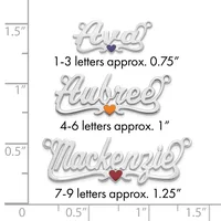 Three silver name charms with colored heart centers displayed next to a ruler showing sizes ranging from 0.75 inches to 1.25 inches.