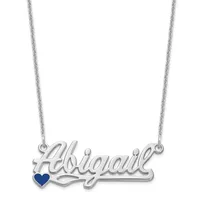 Silver nameplate necklace spelling "Hawaii" with a small dark blue heart beneath the text, suspended from a thin silver chain.