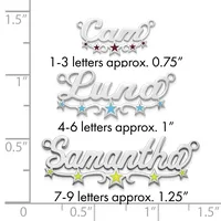 Three silver name charms of increasing sizes with decorative stars, displayed next to a ruler showing dimensions from 0 to 1.5 inches.