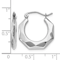 Pair of polished silver twisted hexagonal hoop earrings with a ruler showing dimensions of approximately one inch in height and half inch in width.