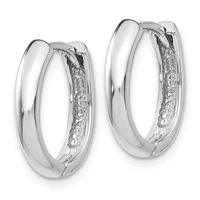 A pair of polished silver hoop earrings with diamond accents running along the inner surface, shown from the front against a white background.