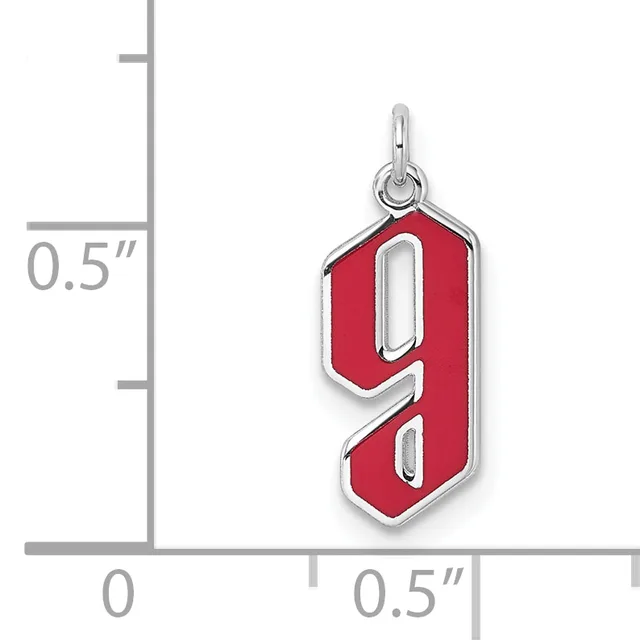 A red enamel pendant shaped like the number 9 with silver-colored metal borders, shown next to a ruler indicating its size is approximately 0.5 inches wide and 0.5 inches tall.