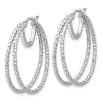 A pair of silver-toned double hoop earrings with a textured diamond-cut finish, shown against a white background.