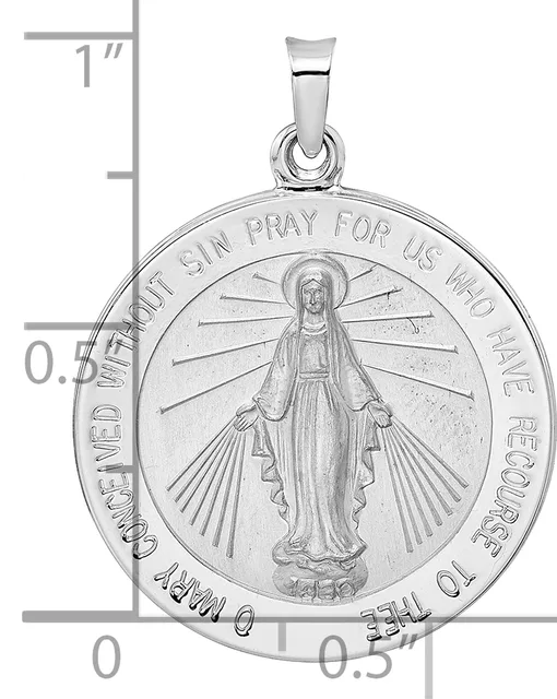 Silver religious medal pendant featuring the Virgin Mary with outstretched arms and radiating rays, surrounded by circular text, shown against a measurement scale.