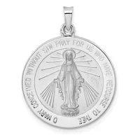 Silver pendant featuring a standing figure with a halo surrounded by radiating lines, with text around the circular border and a small bail loop at the top.