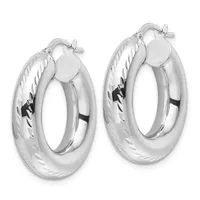 A pair of polished silver hoop earrings with textured surfaces and twist-pattern detailing on the outer edges, shown against a white background.