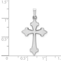 Silver cross pendant with flared four-pointed ends, shown next to a ruler indicating it measures approximately one inch in height.