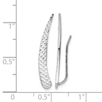 Three silver curved earrings displayed next to a ruler showing measurements up to one inch, with the largest featuring a textured woven pattern.