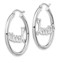 Pair of polished silver hoop earrings with personalized script text attached to the inner surface, shown against a white background.