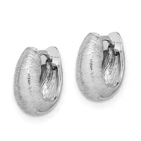 A pair of silver hoop earrings with a brushed texture finish and polished inner surfaces, shown from the front against a white background.