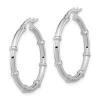 A pair of polished silver hoop earrings with bamboo-textured segmented bands and lever-back closures.