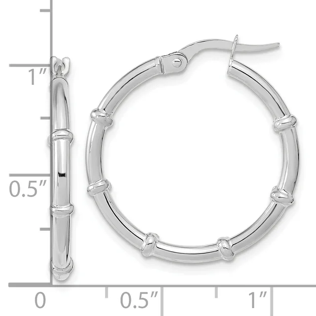 Pair of polished silver-toned hoop earrings with decorative bamboo-style segmented texture, shown with a measurement scale indicating approximately one inch in diameter.