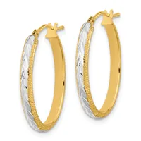 Pair of gold hoop earrings with textured and polished surfaces, featuring white gold or silver-toned striped accents, shown from the front with post and clutch closures.