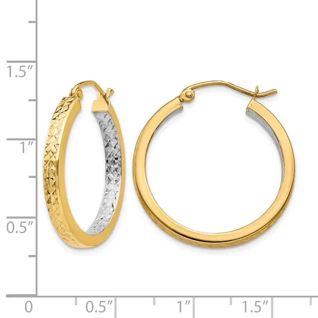 Two-tone hoop earrings with textured gold outer surface and rhodium-plated inner surface, shown next to a measurement scale indicating approximately 1 inch in diameter.