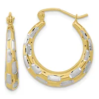 Pair of two-tone gold hoop earrings with textured white and yellow gold sections alternating around the curved surface, shown from front and side angles.