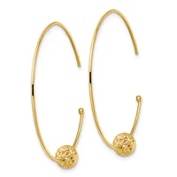 A pair of gold-toned hoop earrings with textured spherical charms hanging from curved wire hooks.