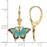 Pair of gold-tone butterfly dangle earrings with turquoise enamel wings and black enamel details, shown against a ruler for scale.