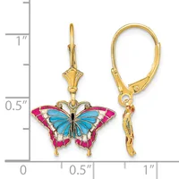 Gold-colored leverback earrings featuring blue and hot pink enamel butterfly charms, shown next to a ruler for scale.
